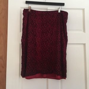 A below-the-knee leopard print skirt